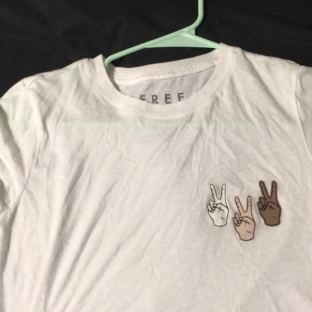White tee with peace sighns